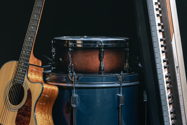 0001_acoustic-guitar-drums-keys-black-background-m_1773739232-a93c2678e4b1440a55a7d192a1a9a629.jpg